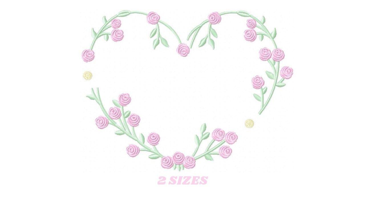May include: A heart-shaped wreath made of green vines with pink roses. The wreath is on a white background. The text "2 SIZES" is below the wreath.