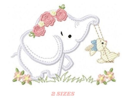 May include: Embroidered design of a white elephant wearing a pink flower crown and holding a yellow bunny on a swing. The elephant and bunny are surrounded by green grass and pink flowers.