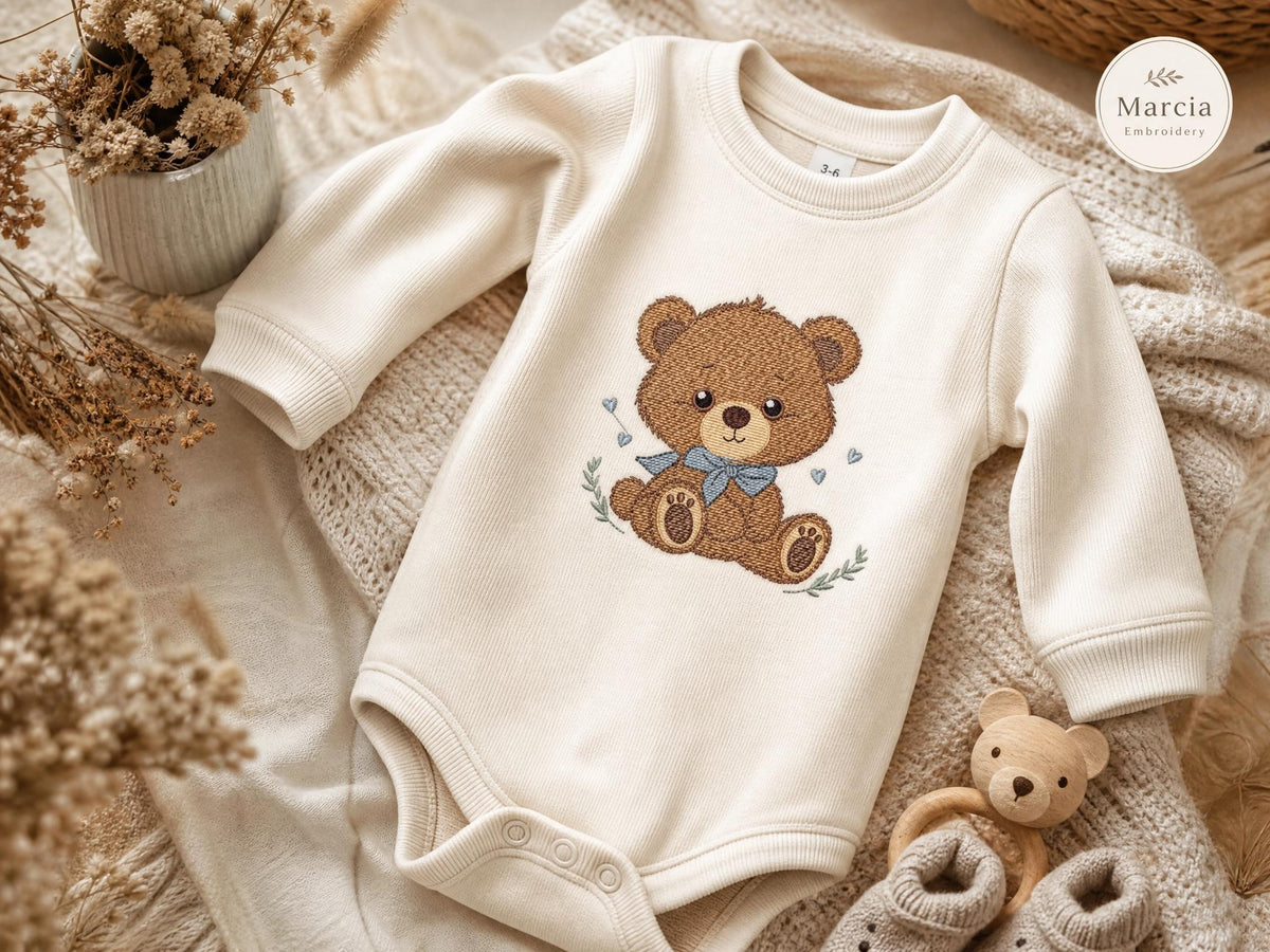 Cream knit romper with stitched teddy bear motif, embroidery designs for kids and babies, cozy nursery styling