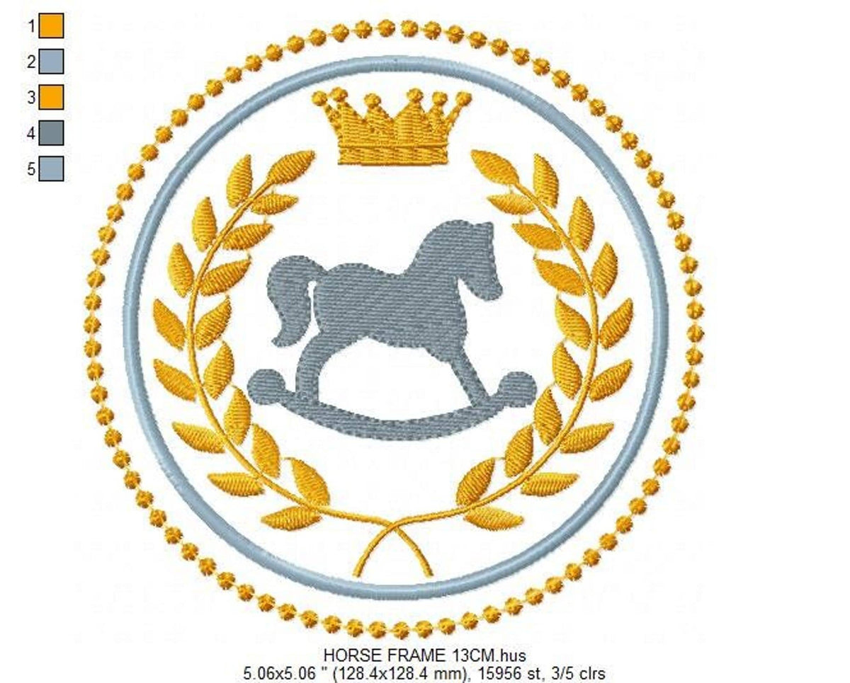 Large hoop view of rocking horse embroidery design, crisp gray stitching, gold wreath leaves and top crown, nursery monogram frame