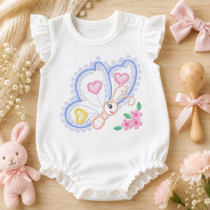 White bodysuit with whimsical heart and butterfly embroidery, baby embroidery designs set styled with plush toys