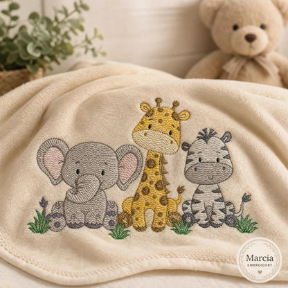 Beige baby blanket with embroidered elephant, giraffe and zebra trio, cute animal embroidery designs for cuddly blankets