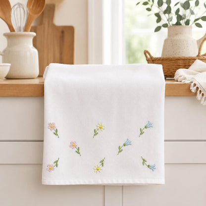 Hand towel with scattered tiny flower and butterfly motifs, delicate wildflower embroidery design download look